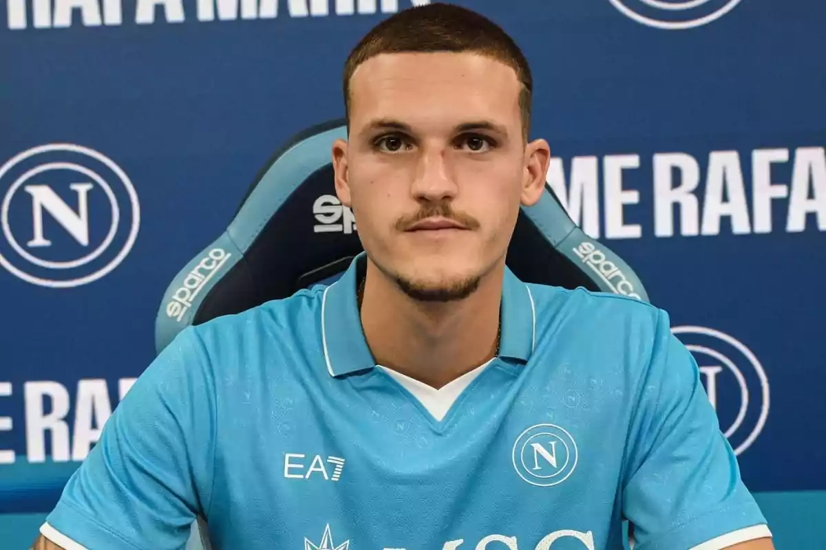 Soccer player with a Napoli shirt at a press conference. Soccer player with a Napoli shirt at a press conference.