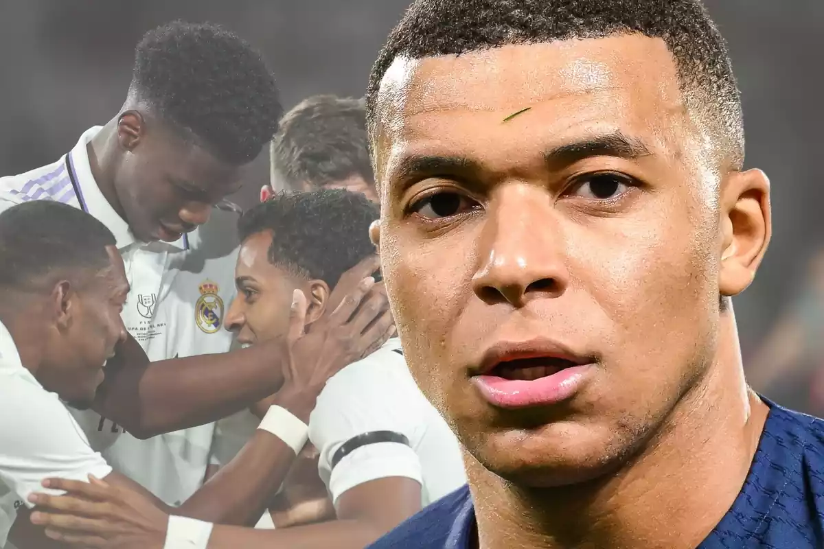 Kylian Mbappé with a scared face with the Real Madrid players in the background