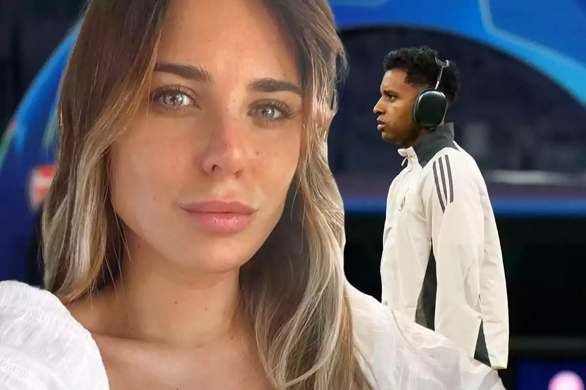 Una mujer en primer plano y un hombre con auriculares en el fondo, ambos en un entorno deportivo.