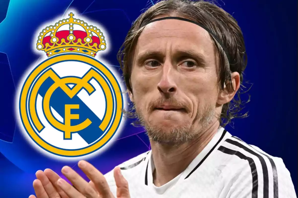 Soccer player in a white jersey applauding in front of the Real Madrid crest against a blue background