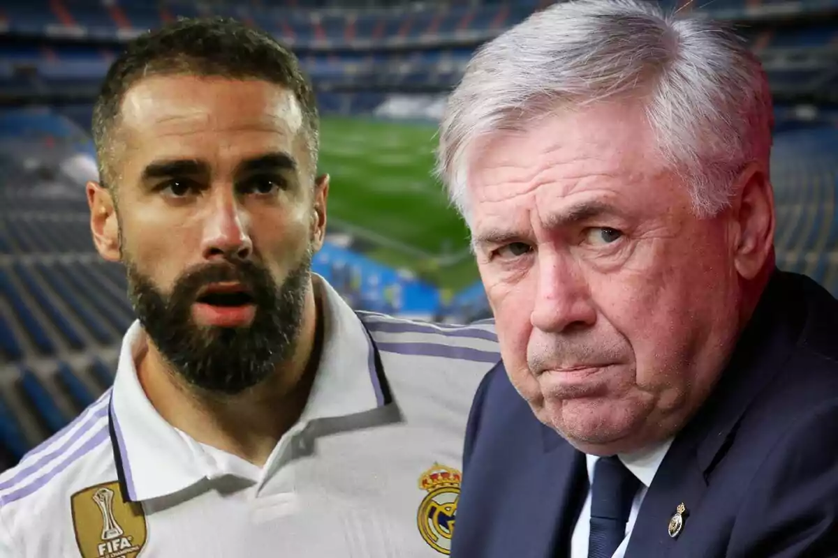 Two men with serious expressions, one in a sports uniform and the other in a suit, in an empty football stadium.