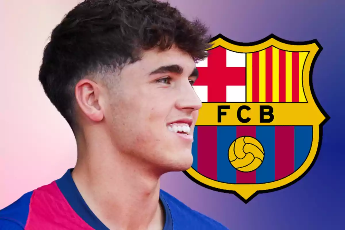 Young man wearing a blue and garnet jersey smiling in front of the FC Barcelona crest