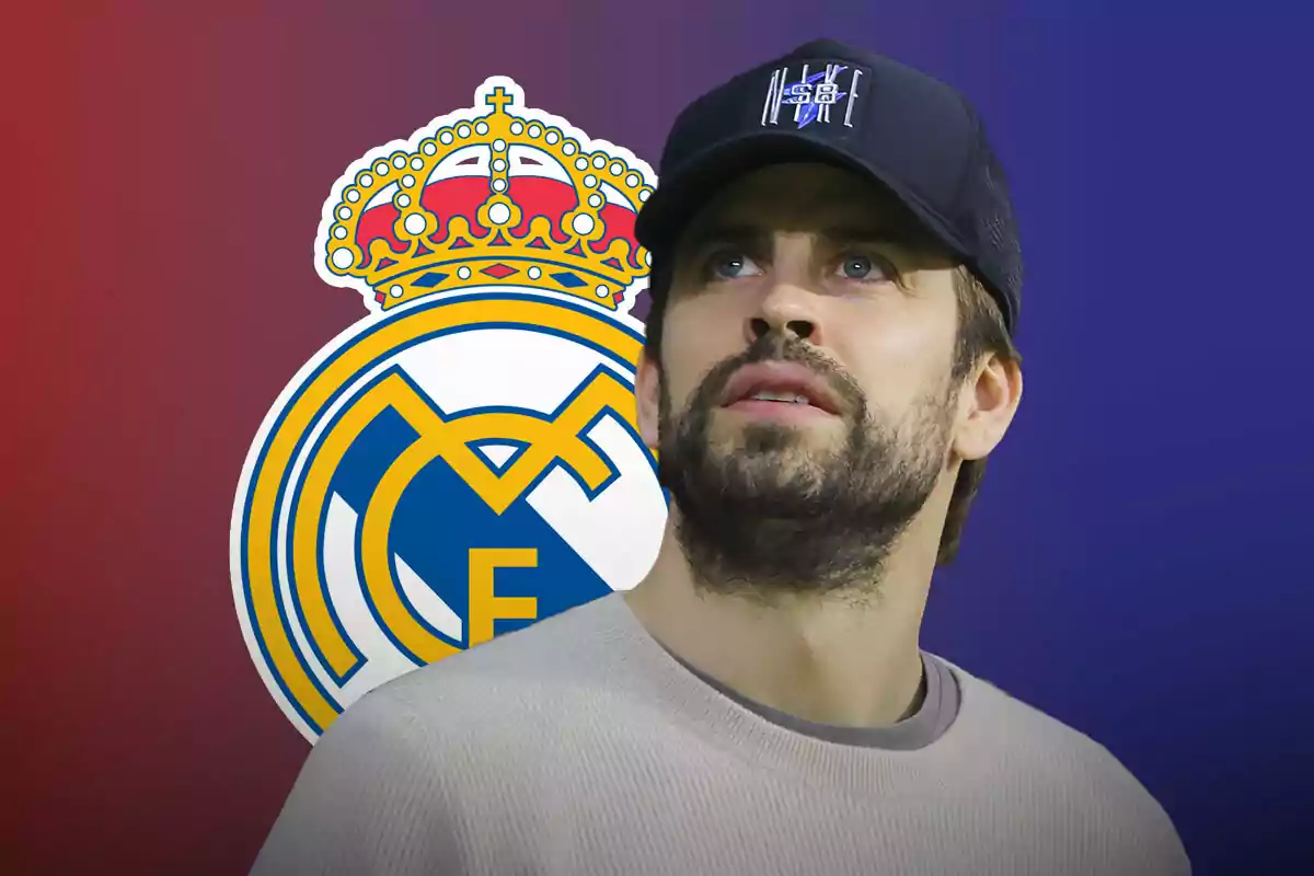 Piqué wearing a cap in front of the Real Madrid logo.