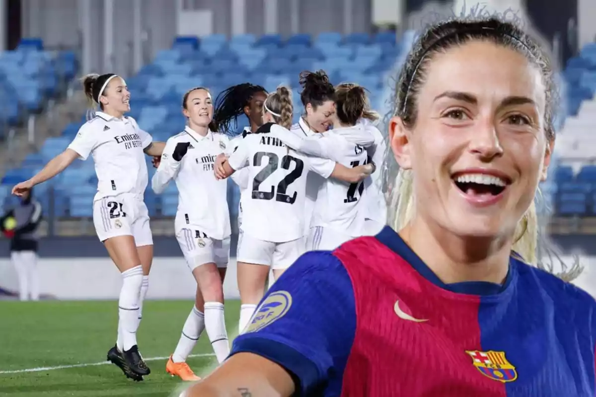 Female soccer players celebrating on the field with a person in the foreground smiling.