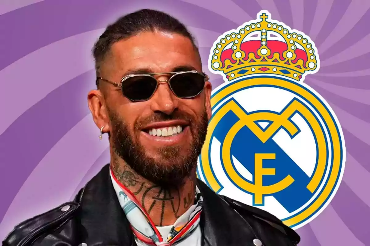 Un hombre con gafas de sol y chaqueta de cuero sonríe frente al escudo del Real Madrid sobre un fondo morado.