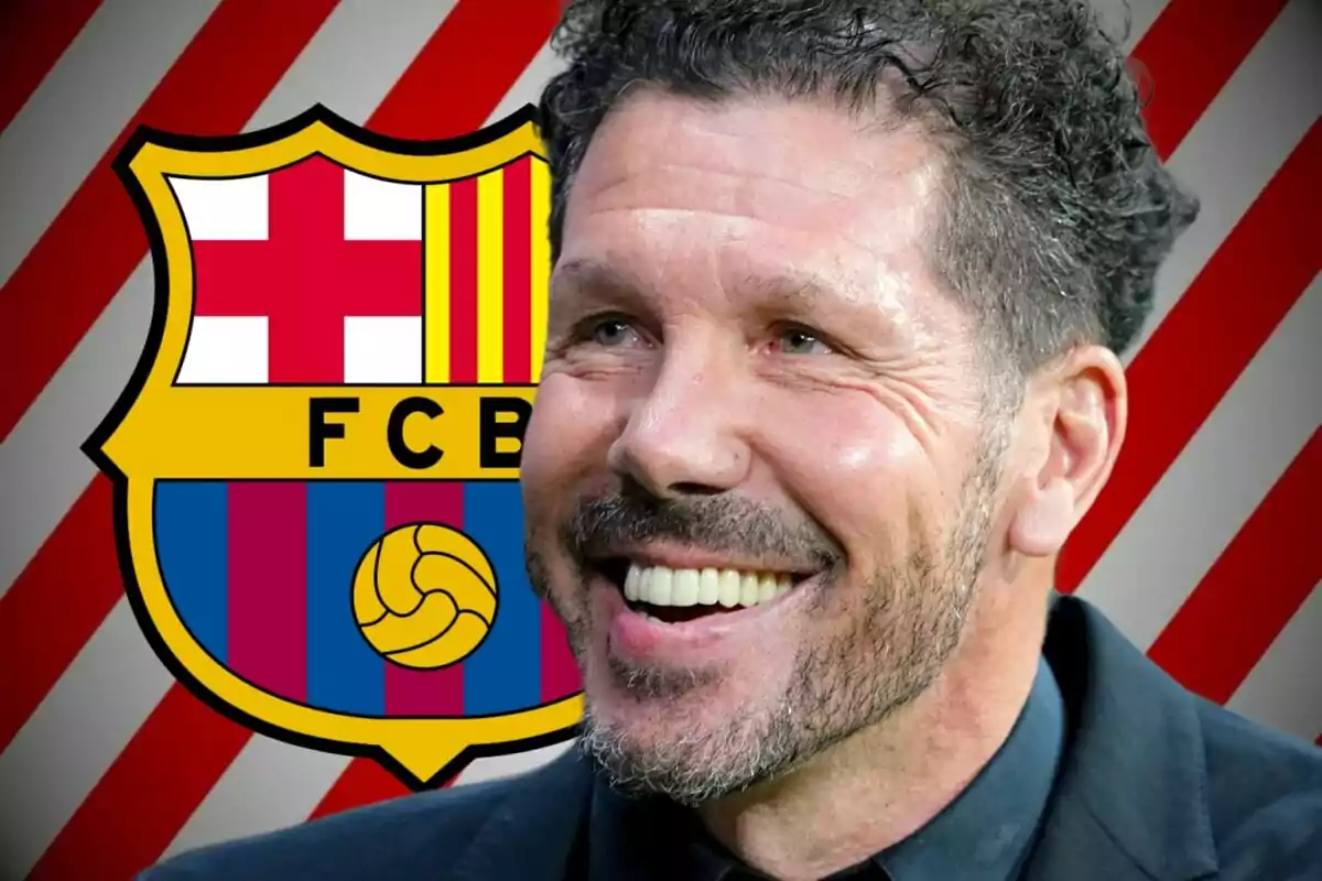 Smiling man with the FC Barcelona crest in the background.