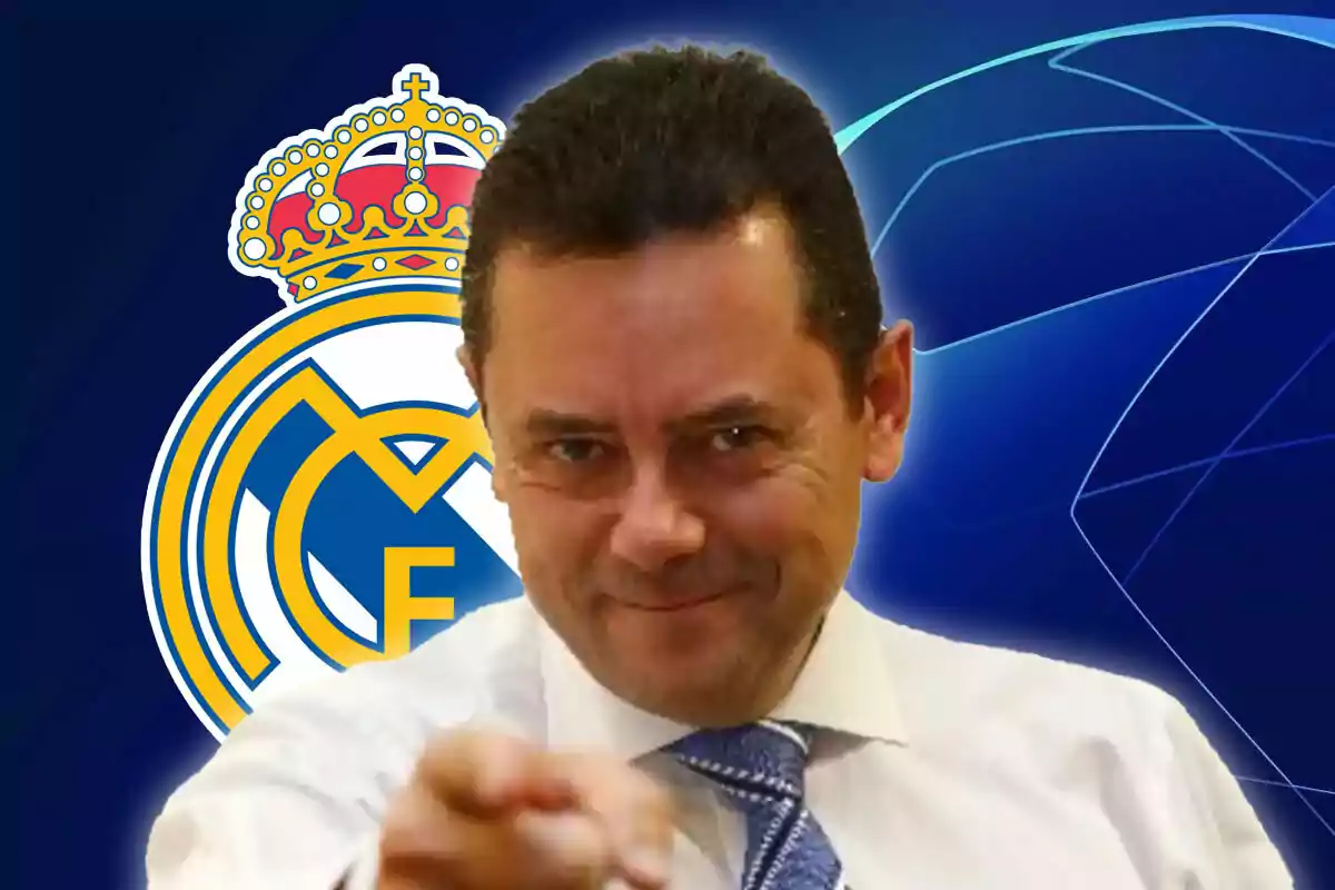 A smiling man in a suit and tie points forward, with the Real Madrid logo in the background.