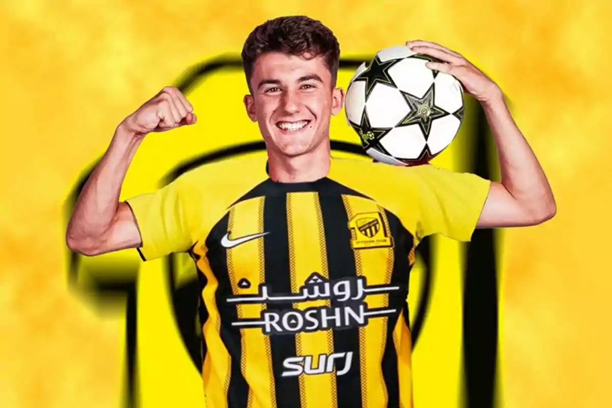 A smiling Unai Hernández in a yellow and black uniform holds a soccer ball over his shoulder. A smiling Unai Hernández in a yellow and black uniform holds a soccer ball over his shoulder.