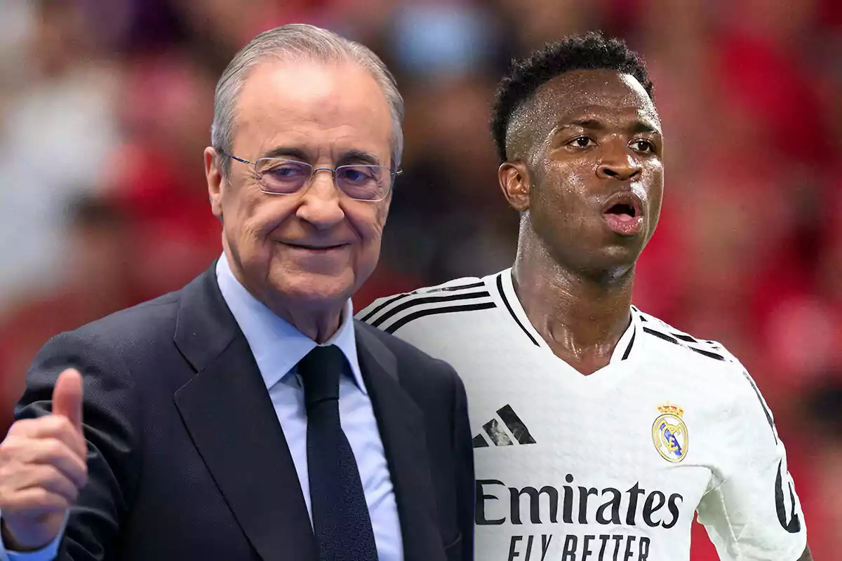 Florentino Pérez con gafas y traje sonríe mientras levanta el pulgar, junto a Vinicius con uniforme blanco en un campo de juego.