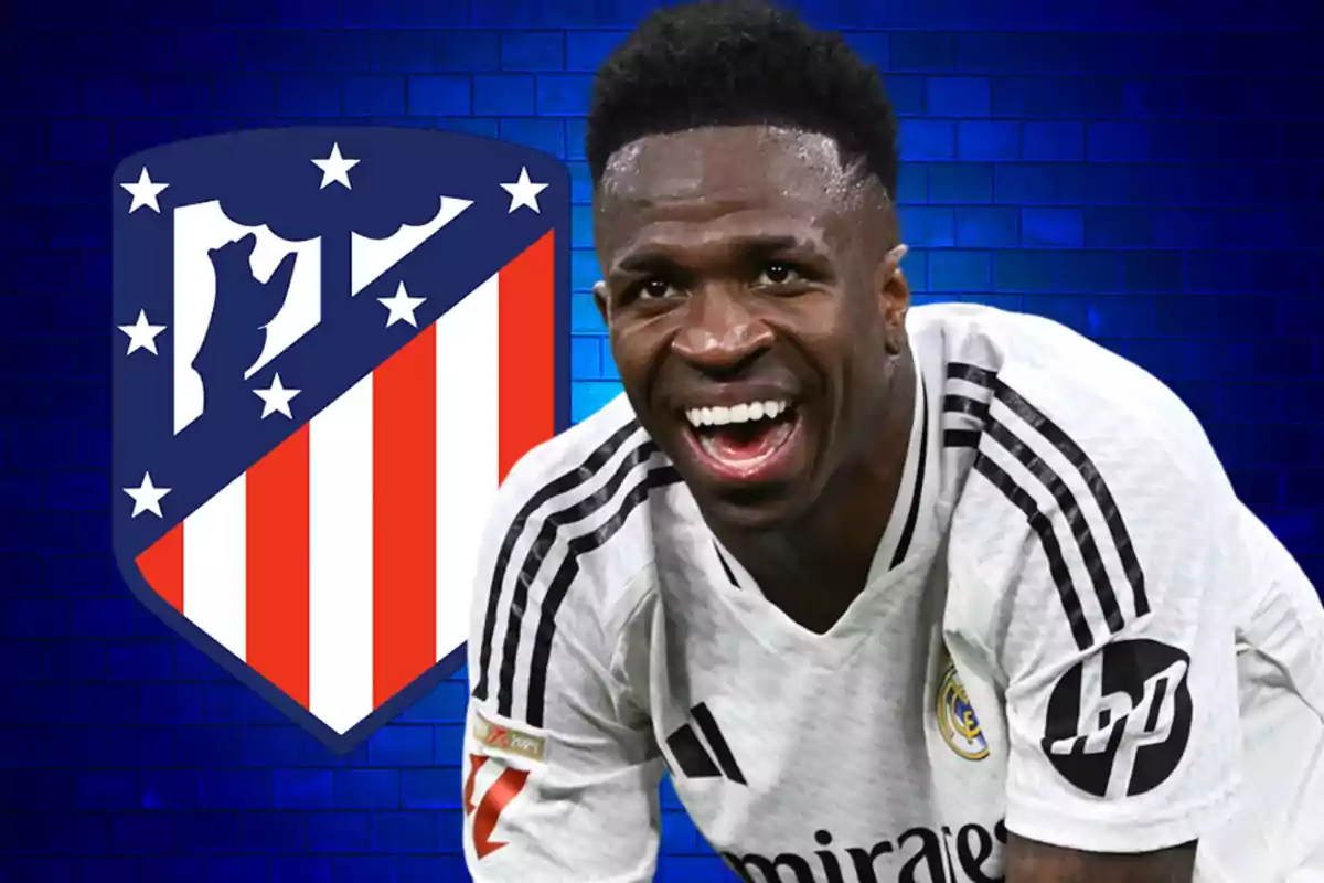 A smiling player in a white jersey in front of the Atlético de Madrid crest on a blue background.