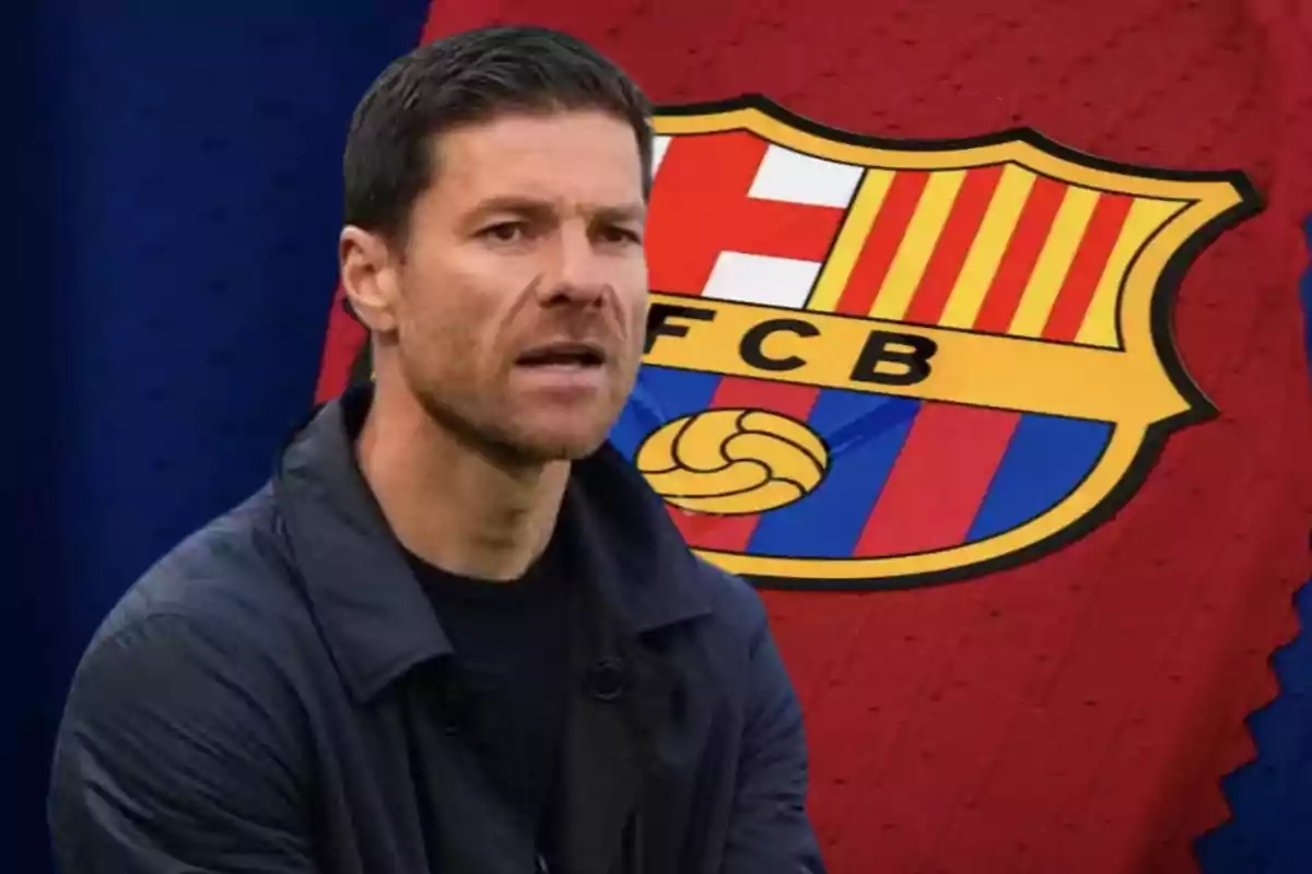 A man in a dark jacket in front of a soccer crest with the letters FCB.